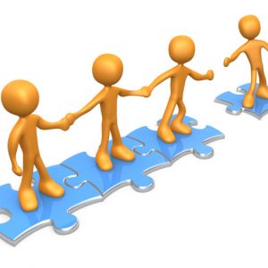 Royalty-free 3d computer generated clipart picture image of a team of three orange people holding hands and standing on blue puzzle pieces, with one man reaching out to connect another to their group, symbolizing teamwork, expansion, membership, seo linking.
